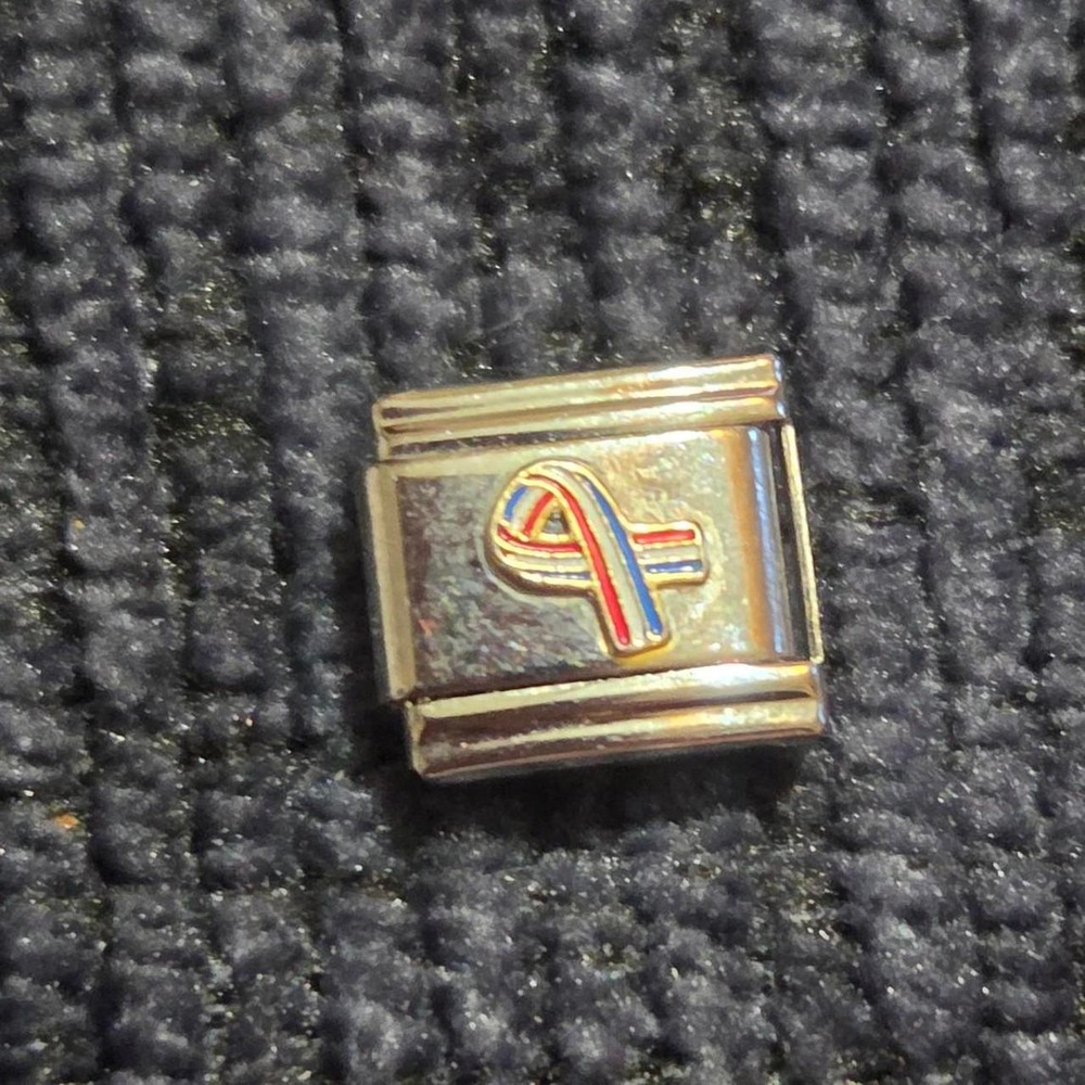 Italian charm with red, white, and blue ribbon